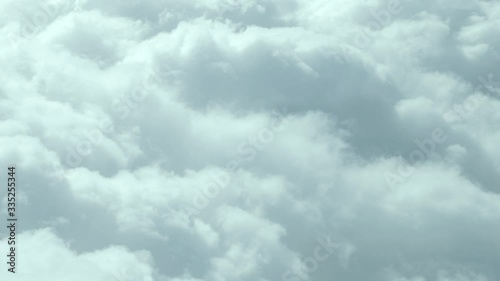 Passing over Fluffy white clouds , way to heaven in UHD photo