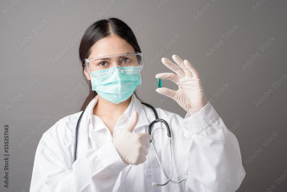 Intelligent Doctor is holding medicine pill Intelligent Doctor is holding medicine pill
