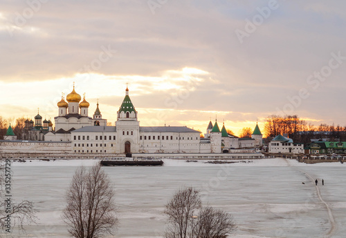 Beautiful View of Ipatievsky monastery in winter orange sunset © julietta24