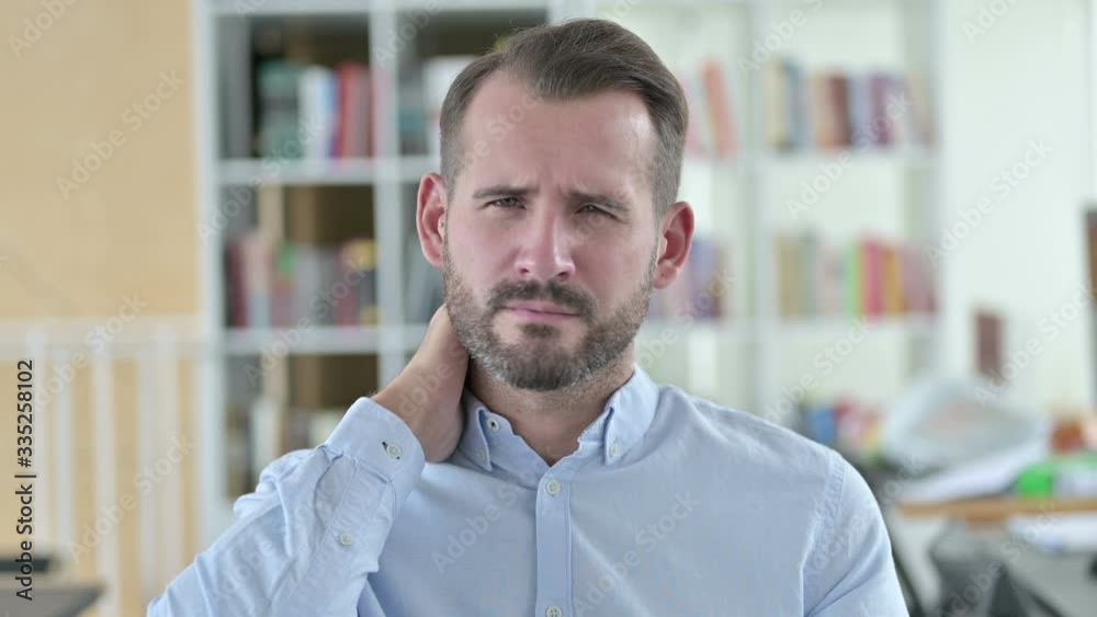 Portrait of Exhausted Young Man with Neck Pain Portrait of Exhausted Young Man with Neck Pain