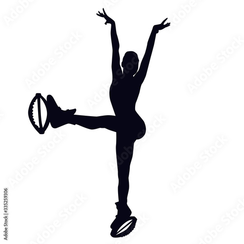 Female silhouette doing leg swing forward in kangoo jump boots. Girl dancing in bounce shoes during high intensity interval training HIIT. Cardio fitness and weight loss. Gaining good shape.