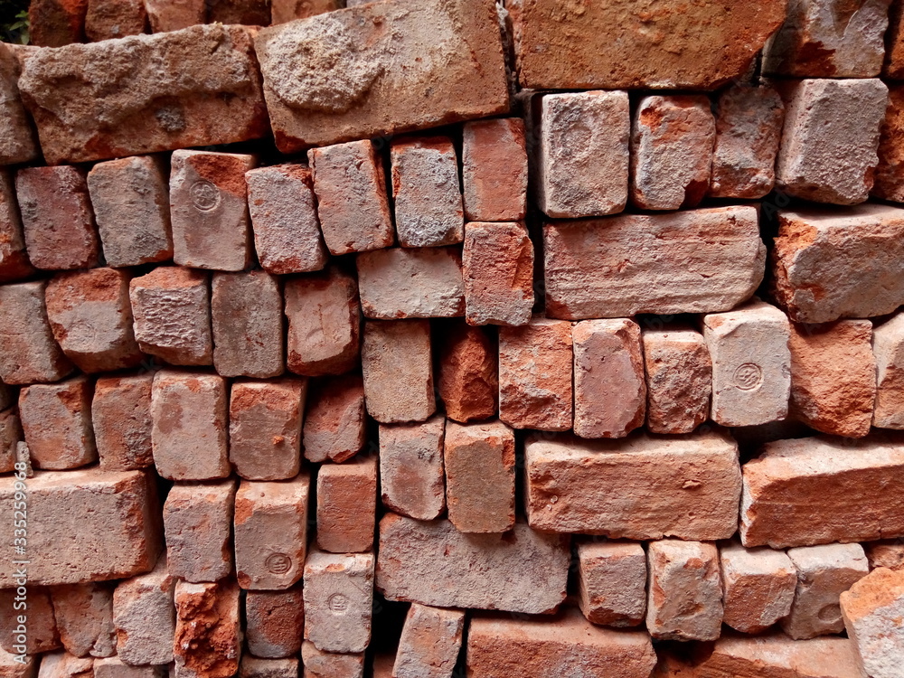 Fototapeta premium Stack of red brick for construction
