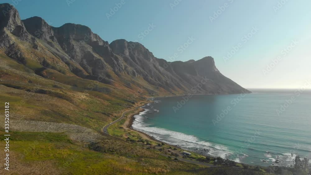 Beautiful aerial drone view of mountain range, coast line road and the sea Beautiful aerial drone view of mountain range, coast line road and the sea