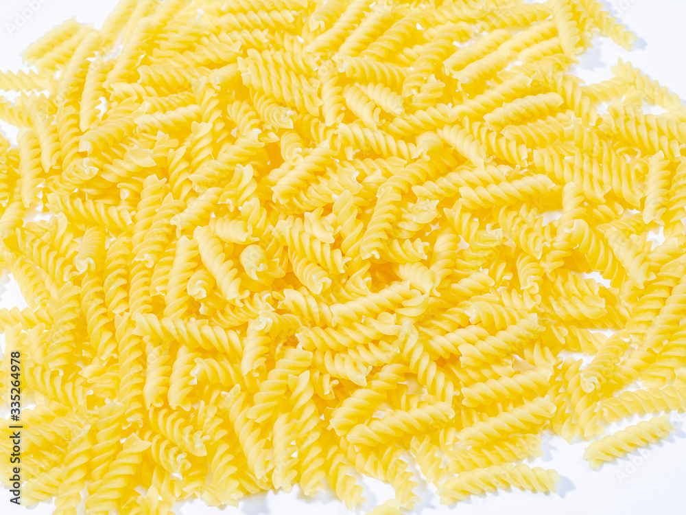 Obraz premium background of yellow italian pasta. healthy lifestyle concept