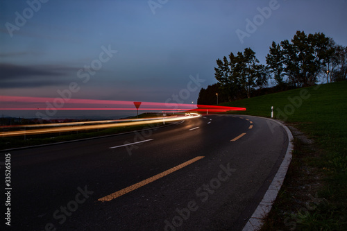 streaks of car lights during sun down in Switzerland © Peter Hofstetter