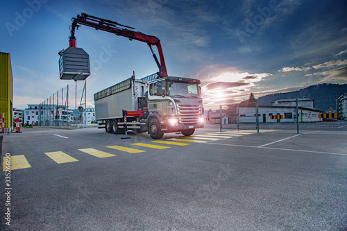 truck with crane emtying recycle. Green planet