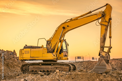 Excavator on the road construction works. Machinery needed for construction