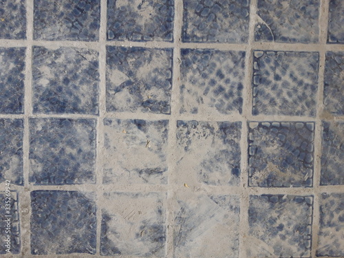 navy tile on cement texture