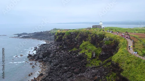 Beautiful greenery view from the rocky beach in Seopjikoji, Jeju. photo