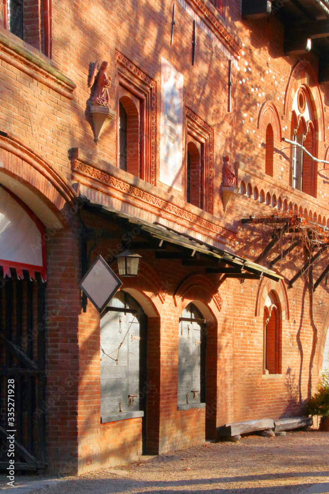 Fototapeta premium medieval old red bricks building in turin city in italy 