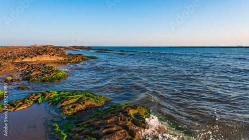 Colorful sunrise on the sea coast