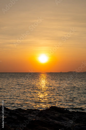 Beautiful sunset ocean scene vertical image size