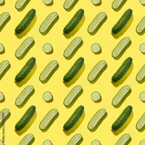 Seamless pattern of cucumbers on yellow background.