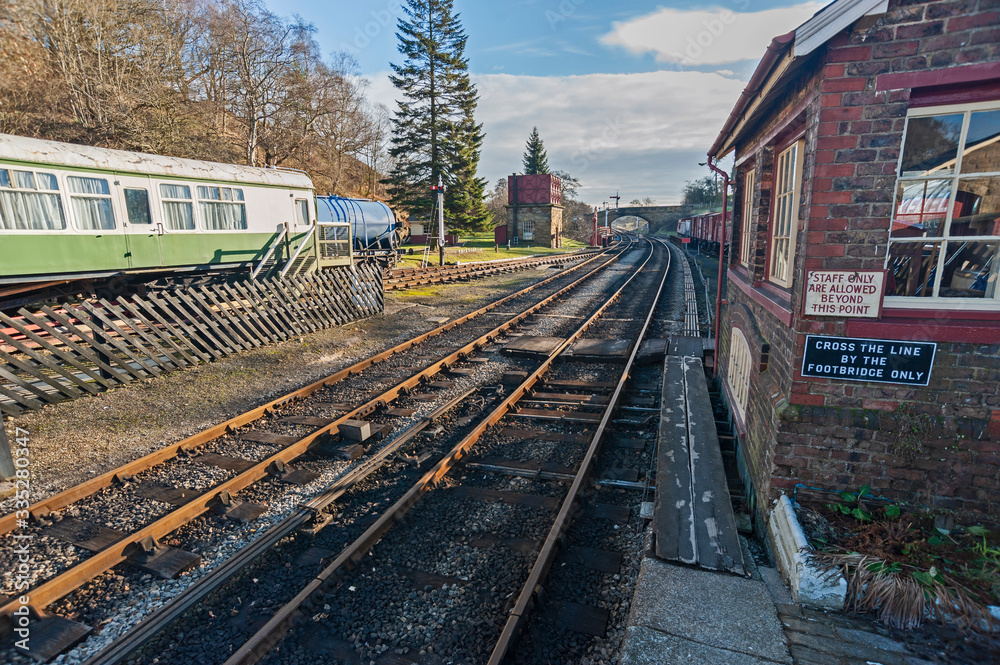 Fototapeta premium Traditional railway station with rolling stock in a siding