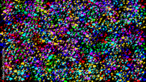 Colorful bright blurry paint dots on a black background