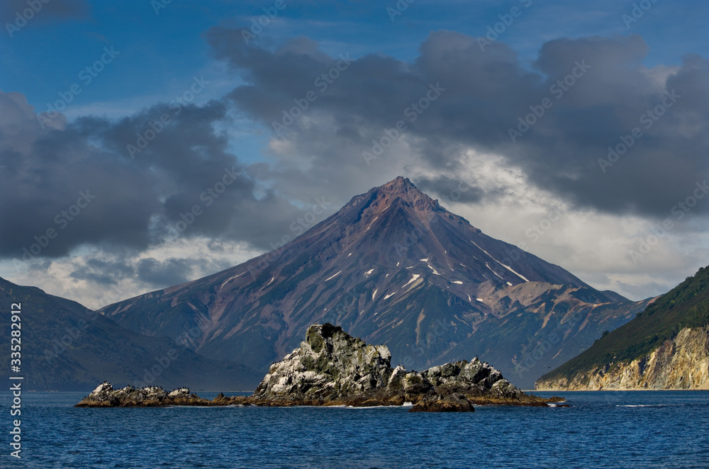 Russia. Far East, Kamchatka Peninsula. Along the coast of the Avacha Bay are scattered many rocky Islands inhabited by gulls and cormorants.