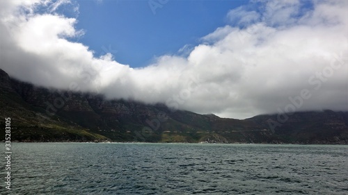 Falls Bay Cape Town Ocean and low fluffy clouds on the mountains