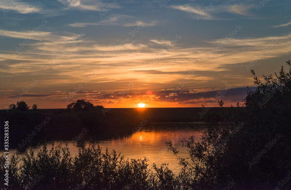 Beautiful sunset under the wild pond Beautiful sunset under the wild pond