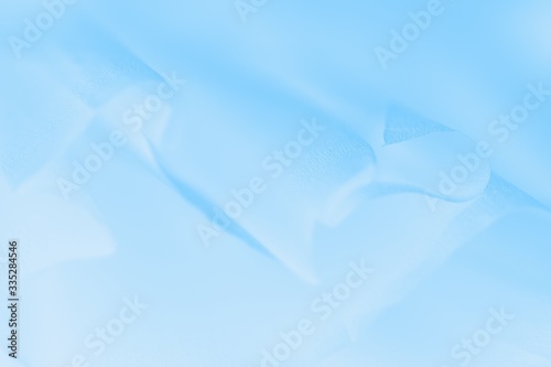 Pale delicate soft blue gradient abstract background. Fabric background photo