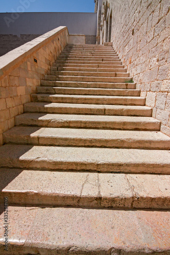 View of the stairs of the medieval castle of Trani in Puglia, Italy. © serghi8