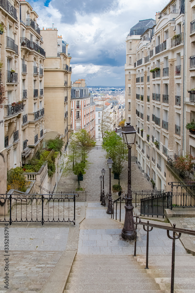 Obraz premium Paris, romantic staircase in Montmartre, typical buildings and floor lamp 