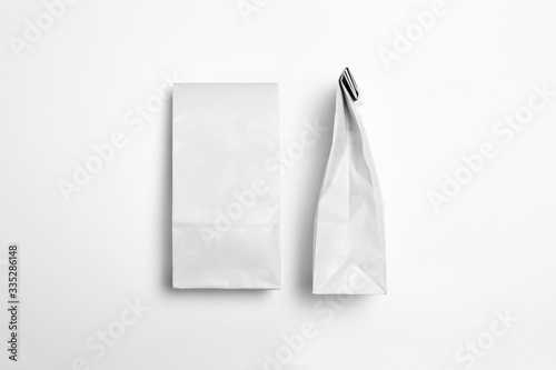 White blank Paper Packages Mock-up for dry products on white background.Front and backside. High-resolution photo.