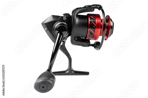 Fishing reel isolated on white background with clipping path. Modern fishing reel isolated over white. Fishing tackle background