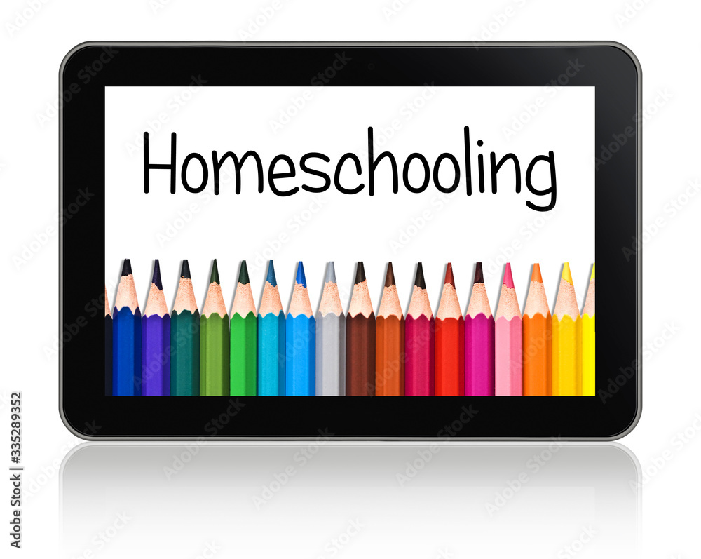 Naklejka premium Homeschooling written on a tablet with a colorful lineof pencils
