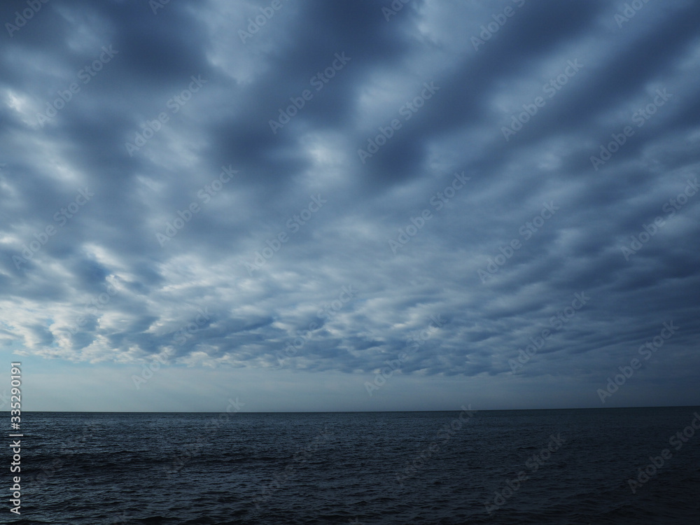Obraz premium blue sea and cloudy sky over it. Blue Sea sky and Clouds by aerial drone.