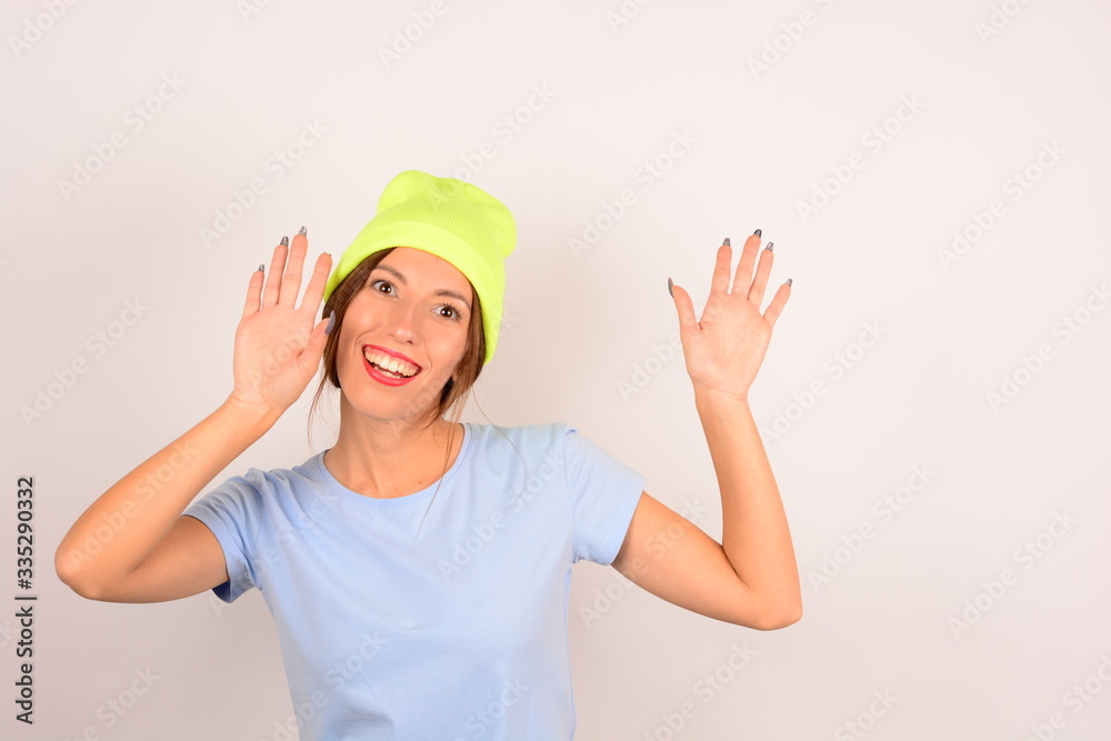 portrait of a joyful woman in a yellow hat
