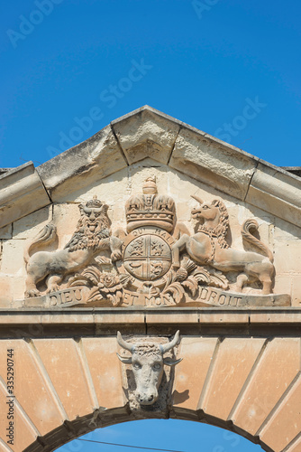 Malta / Malta 09/30/2015.Valletta, Malta. Coat of arms, the unicorn, the lion and a crown on a triangular pediment