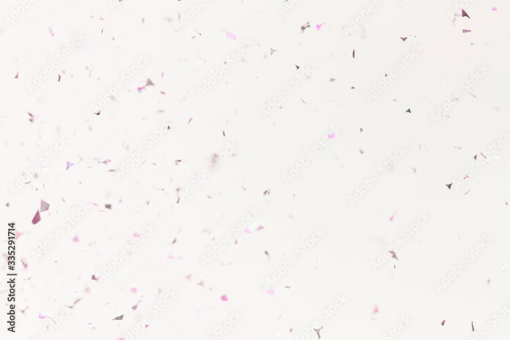 Flying silver confetti on a purple background. Template for advertising, blog or text. Festive background