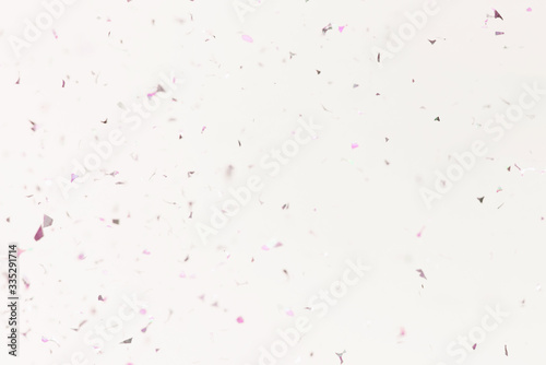 Flying silver confetti on a purple background. Template for advertising, blog or text. Festive background