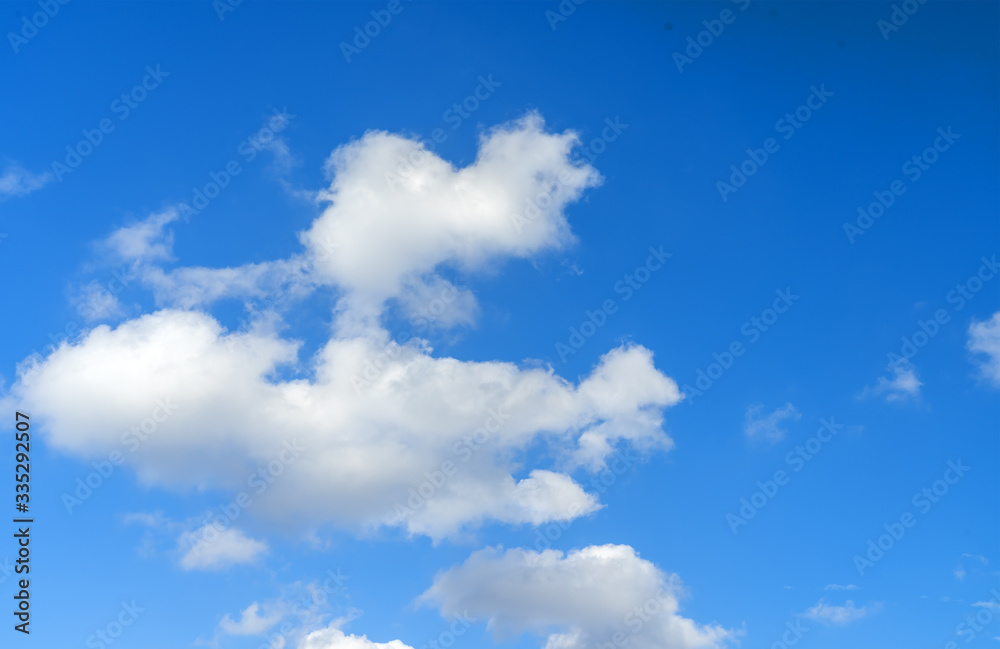 Large white clouds on a blue sky. Clear day. Background, blank for designers. Large white clouds on a blue sky. Clear day. Background, blank for designers.