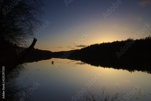 Sunset on the lake in the woods