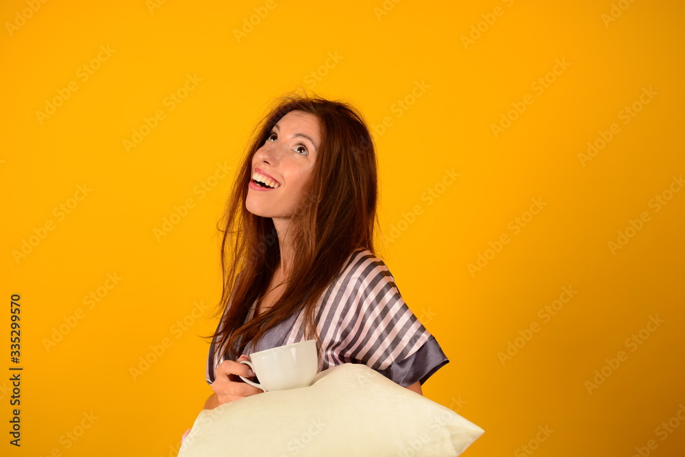 woman woke up in the morning on a yellow background woman woke up in the morning on a yellow background