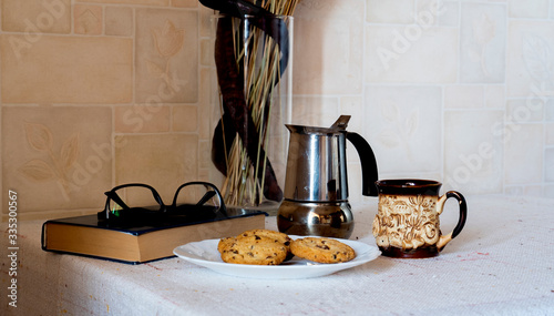 reading a book with coffee and cookies