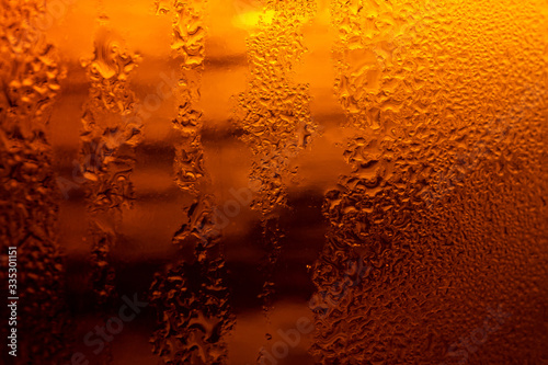 Texture of water drops on the bottle of beer,Macro beer surface