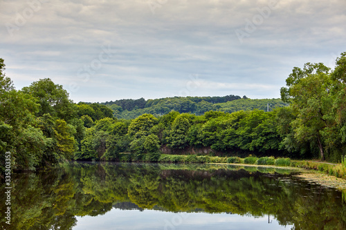 Image of the Vilaine Riverside with trees and reflections in the water