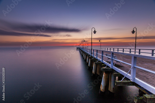 Amazing sunrise over wooden pier in Gdynia Orlowo. © R_Szatkowski