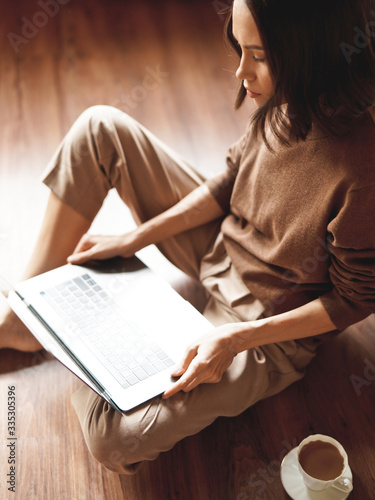 Woman working at notebook