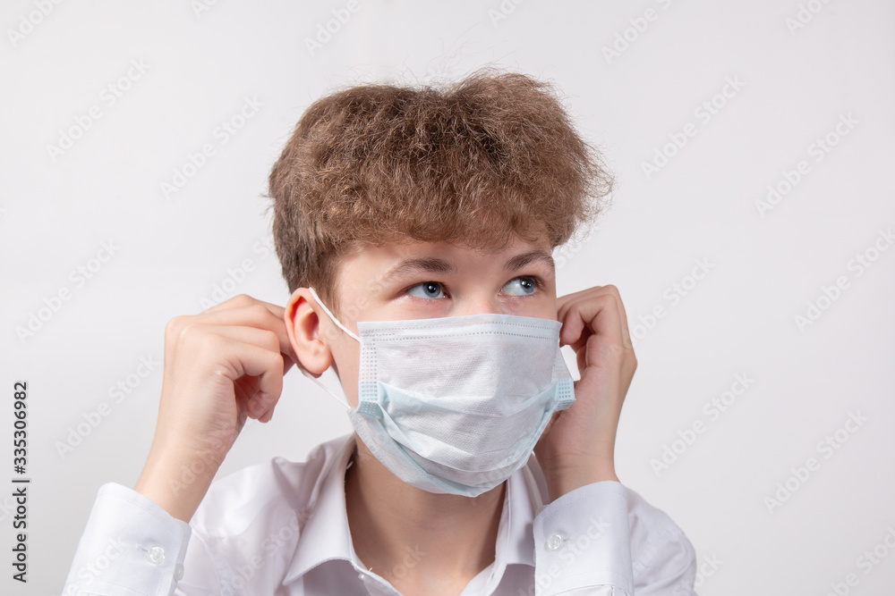 Portrait of young boy in protective medical mask