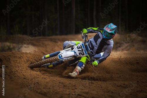 Canvas Print Rider driving in the motocross race