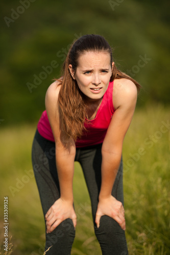 Beautiful young woman rests after a long run workout outdoor in nature © Samo Trebizan