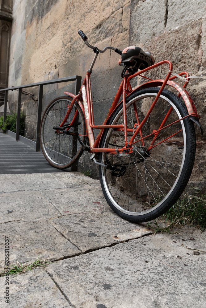 Old vintage orange bicycle urban   