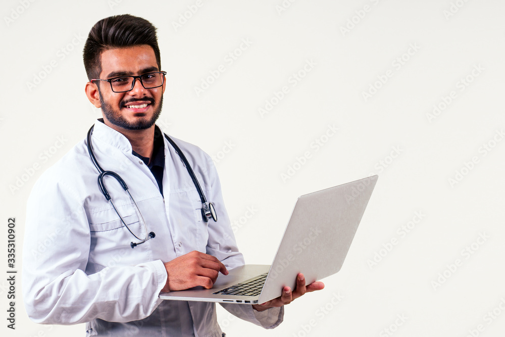 Portrait of indian male doctor checking medicine white isolate studio background.remote freelancing concept Portrait of indian male doctor checking medicine white isolate studio background.remote freelancing concept