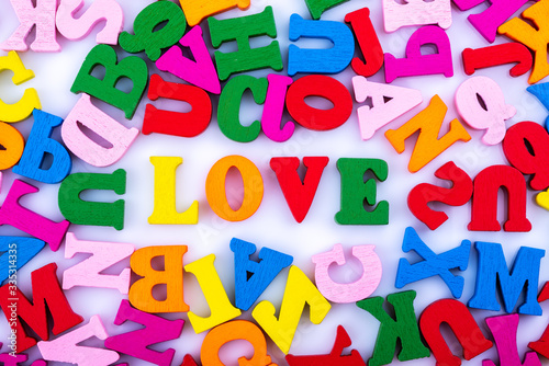 The word love from the alphabet letters isolated on a white background. Close up.