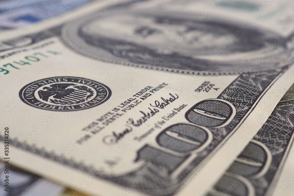 US money banknotes of 100 dollars old and new type close-up. Interest rate  of the Federal Reserve System. Emission. National currency. Focus on the  Fed stamp. Macro фотография Stock | Adobe Stock