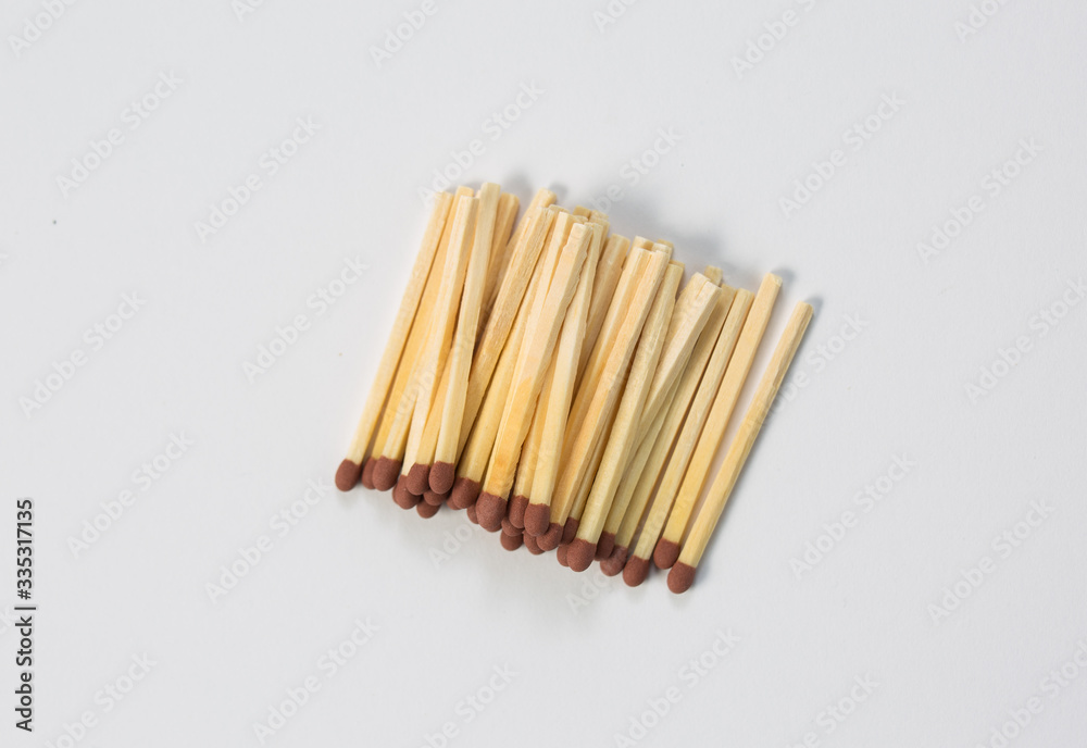 Close-up of a red match isolated on a white. Close-up of a red match isolated on a white.