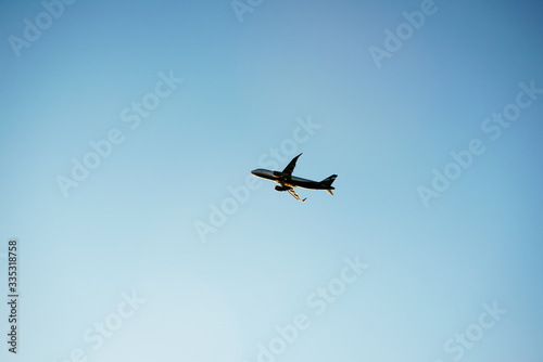 a lone plane in the blue sky